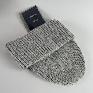 Stay cozy and stylish with this Acne Studios knitted hat."